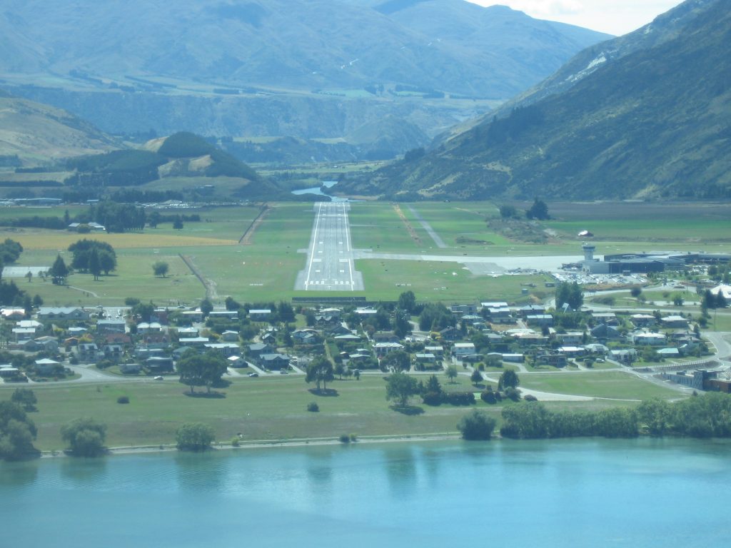 Take off from Queenstown picturesque runway and fly over the rugged landscape 